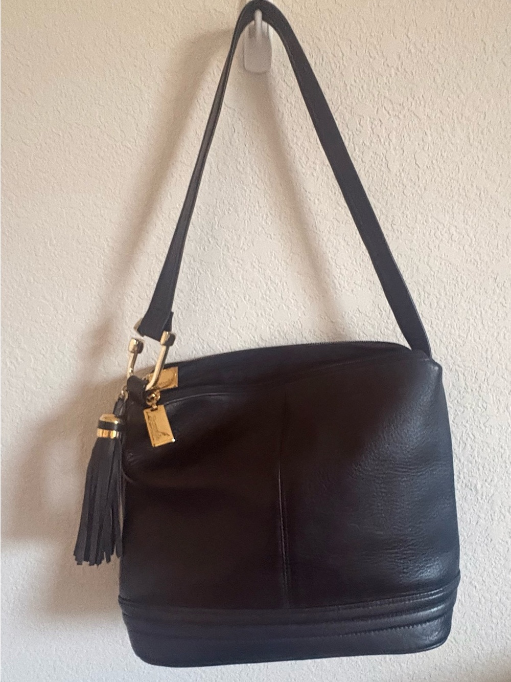 Tignanello Black Pebbled Leather Triple Compartment Tassel Crossbody Bag